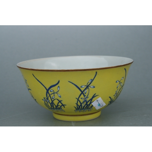 516 - A Chinese footed bowl decorated with flowers on an Imperial yellow ground, four character red mark t... 