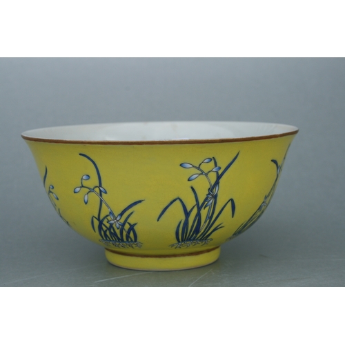 516 - A Chinese footed bowl decorated with flowers on an Imperial yellow ground, four character red mark t... 