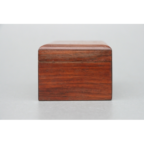 556 - A Chinese hardwood rectangular box and cover (possibly huanghuali), the cover with inlaid decoration... 