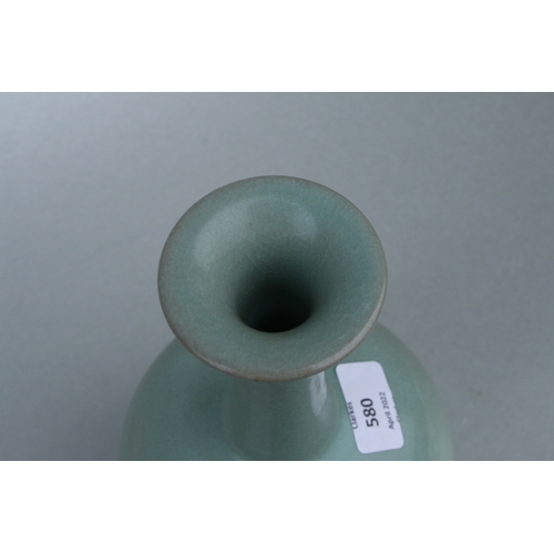 580 - A Chinese celadon crackle glazed vase, 26cms high.