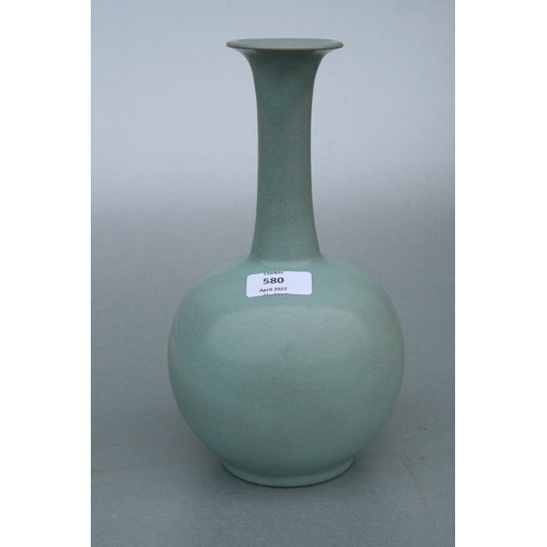 580 - A Chinese celadon crackle glazed vase, 26cms high.