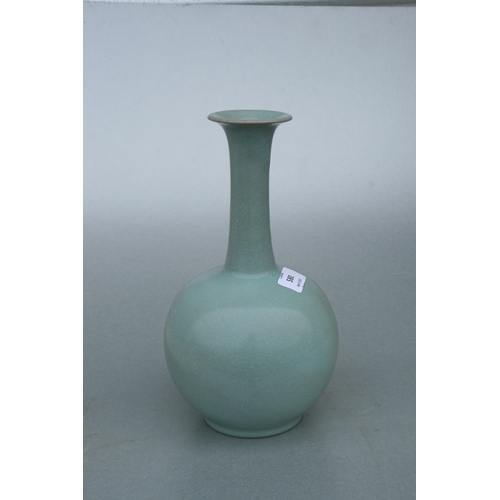 580 - A Chinese celadon crackle glazed vase, 26cms high.