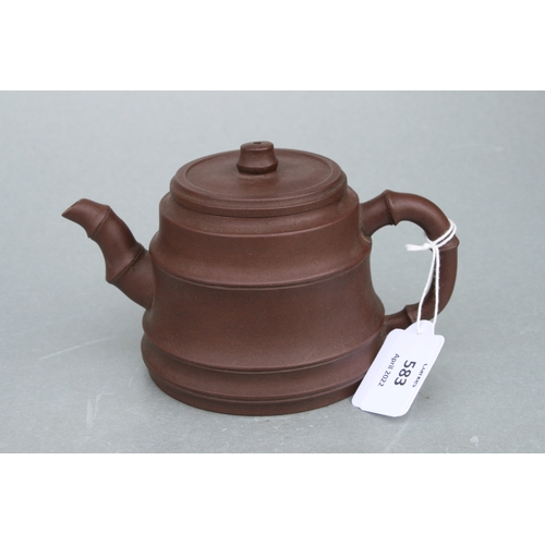 583 - A Chinese Yixing pottery teapot with stylised bamboo spout and handle, impressed seal mark to the un... 