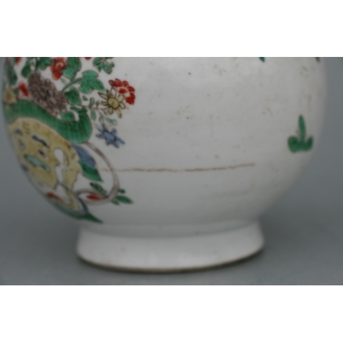 617 - A Chinese Kangxi famille rose triple gourd vase decorated with precious objects, 26cms high.