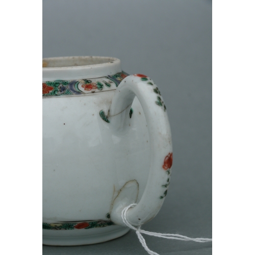 619 - A Chinese famille rose teapot of globular form, decorated with sgraffito and flowers, 11cms high.