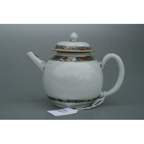 619 - A Chinese famille rose teapot of globular form, decorated with sgraffito and flowers, 11cms high.