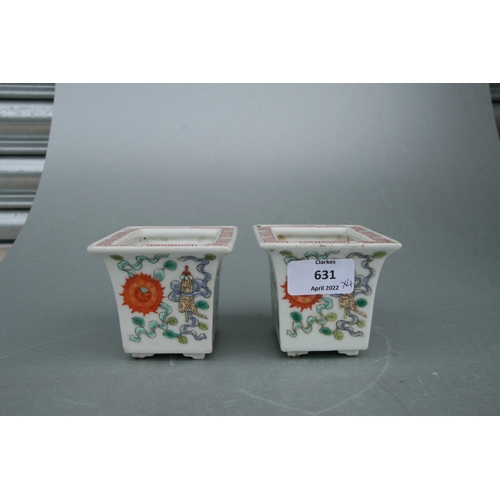 631 - A pair of rectangular form Chinese famille rose planters on stands decorated with precious objects, ... 