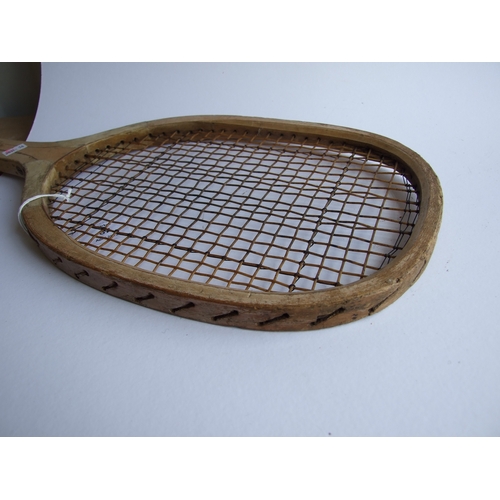 87 - A vintage Model D tennis racquet, 69cms long.