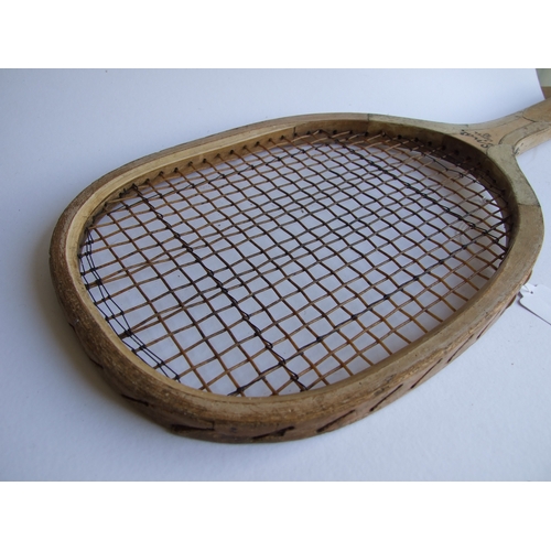 87 - A vintage Model D tennis racquet, 69cms long.