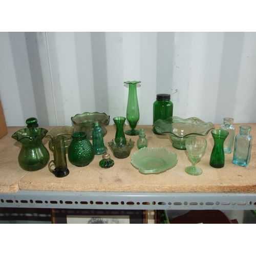 244 - A quantity of green pressed and moulded glass to include hyacinth and tulip vases and a pair of Fren... 