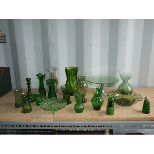 244 - A quantity of green pressed and moulded glass to include hyacinth and tulip vases and a pair of Fren... 