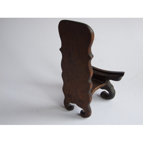 596 - Two Chinese hardwood plate stands, the largest 18cms high (2).