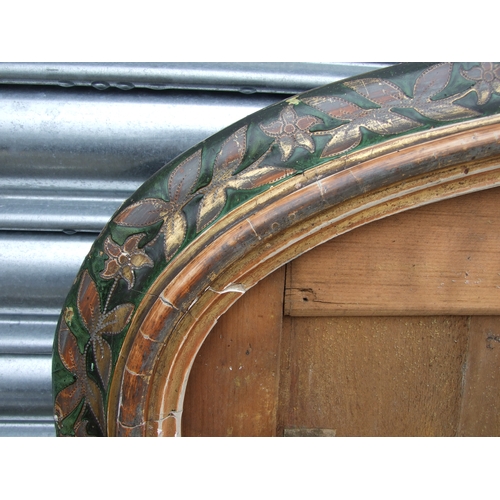 694 - A Victorian overmantle mirror frame with gilded and painted floral decoration, 104cms wide.