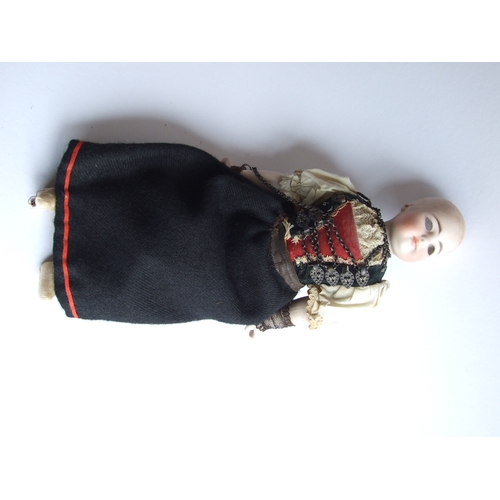 71 - A German bisque headed doll, 31cms high.