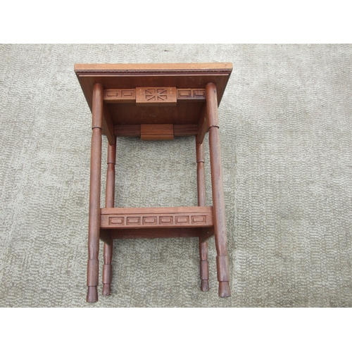 707 - An Arts & Crafts style inlaid two-tier occasional table, 53cms wide.