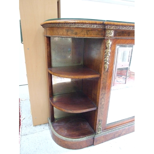 760 - A 19th century figured walnut Credenza, the pair of mirrored doors enclosing a shelved interior flan... 