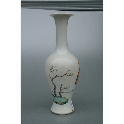 634 - A Chinese famille rose baluster vase decorated with figures and bats, 26cms high.