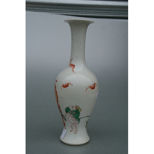 634 - A Chinese famille rose baluster vase decorated with figures and bats, 26cms high.