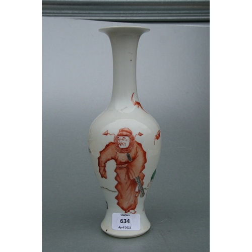 634 - A Chinese famille rose baluster vase decorated with figures and bats, 26cms high.