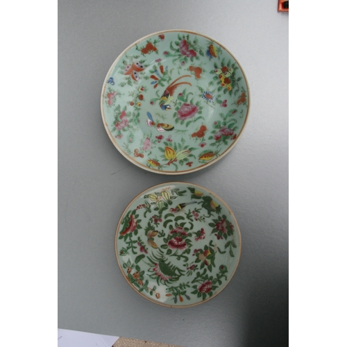 636 - Two Chinese Canton Export plates decorated with birds, flowers and insects; together with a similar ... 