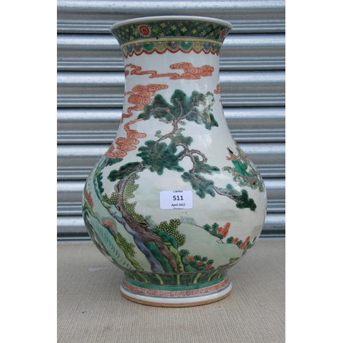 511 - A large Chinese famille rose vase decorated with figures in a landscape, 37cms high.