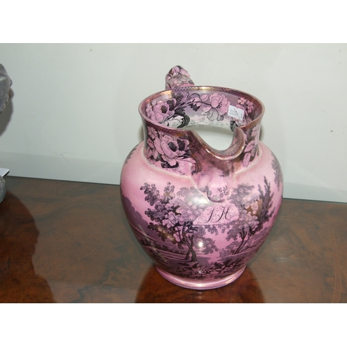 250 - A Victorian pink lustre ware jug, transfer printed with a landscape scene with a castle in the dista... 