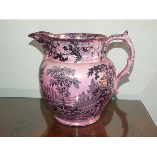 250 - A Victorian pink lustre ware jug, transfer printed with a landscape scene with a castle in the dista... 