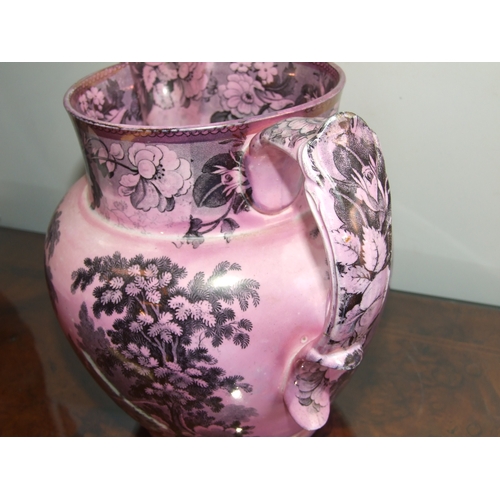 250 - A Victorian pink lustre ware jug, transfer printed with a landscape scene with a castle in the dista... 