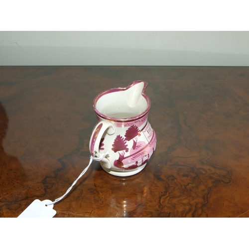 250 - A Victorian pink lustre ware jug, transfer printed with a landscape scene with a castle in the dista... 