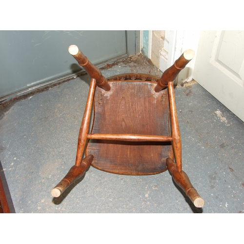 685 - Three elm and fruitwood kitchen chairs on turned legs joined by a stretcher (3).