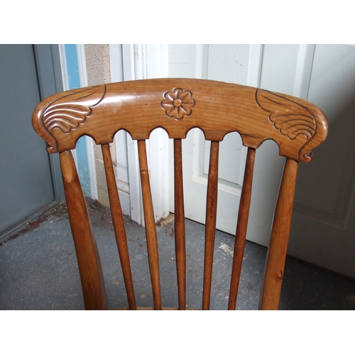 685 - Three elm and fruitwood kitchen chairs on turned legs joined by a stretcher (3).