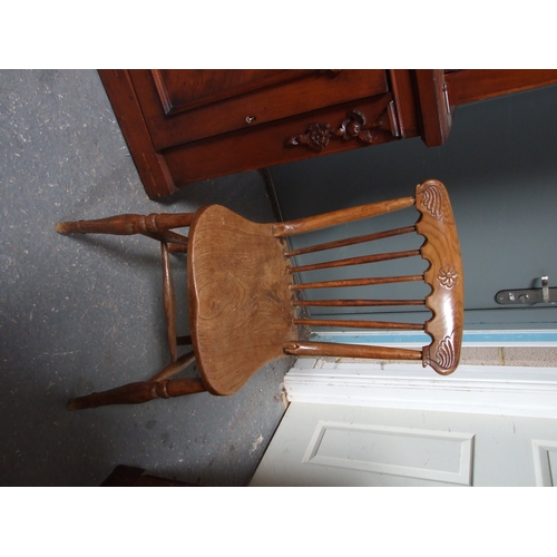 685 - Three elm and fruitwood kitchen chairs on turned legs joined by a stretcher (3).