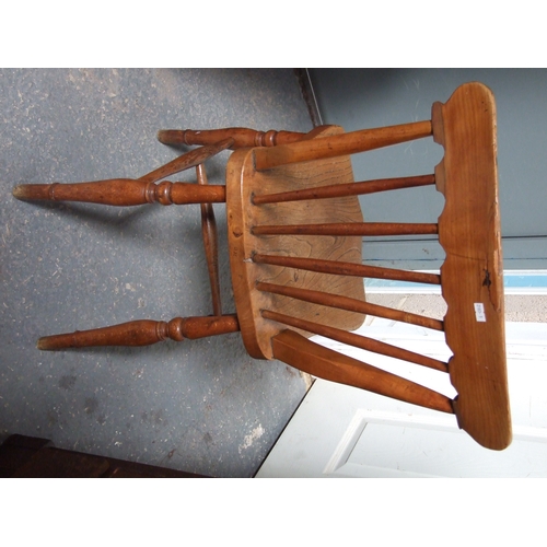 685 - Three elm and fruitwood kitchen chairs on turned legs joined by a stretcher (3).