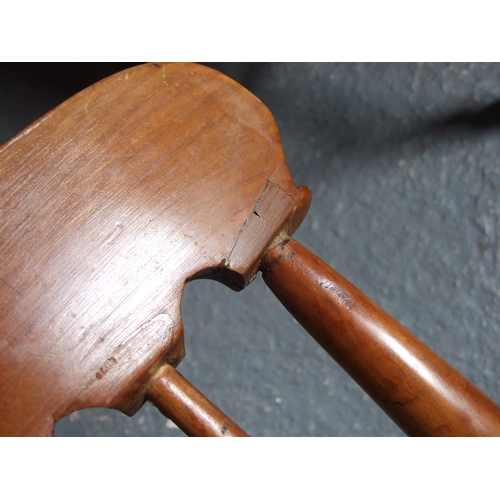 685 - Three elm and fruitwood kitchen chairs on turned legs joined by a stretcher (3).