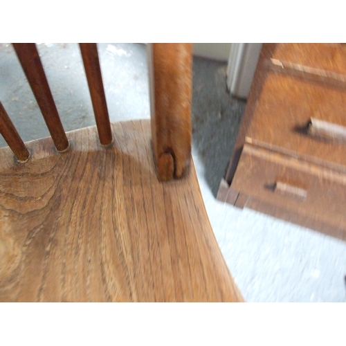 685 - Three elm and fruitwood kitchen chairs on turned legs joined by a stretcher (3).