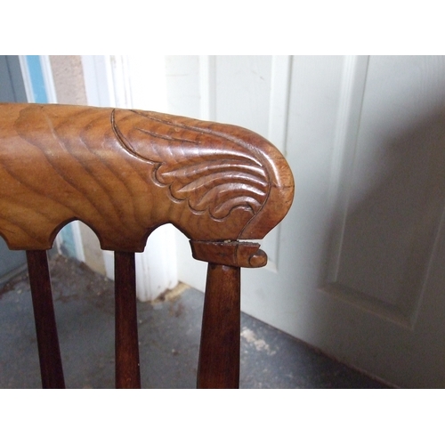 685 - Three elm and fruitwood kitchen chairs on turned legs joined by a stretcher (3).