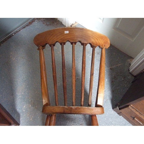 685 - Three elm and fruitwood kitchen chairs on turned legs joined by a stretcher (3).