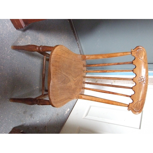 685 - Three elm and fruitwood kitchen chairs on turned legs joined by a stretcher (3).