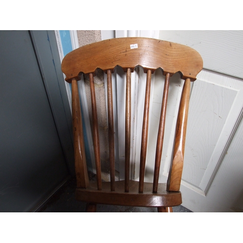 685 - Three elm and fruitwood kitchen chairs on turned legs joined by a stretcher (3).