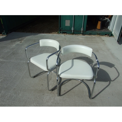 679 - A set of four French Soudex Vinyl tubular chrome and white vinyl dining chairs (4).