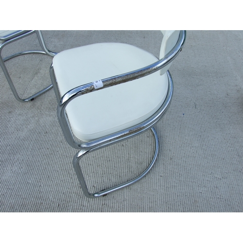 679 - A set of four French Soudex Vinyl tubular chrome and white vinyl dining chairs (4).