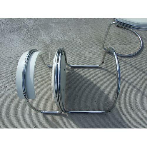 679 - A set of four French Soudex Vinyl tubular chrome and white vinyl dining chairs (4).