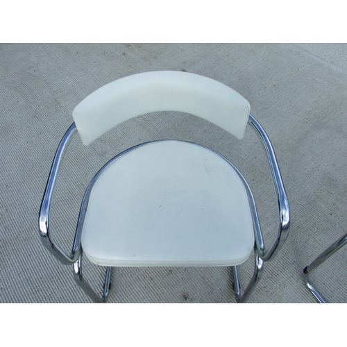 679 - A set of four French Soudex Vinyl tubular chrome and white vinyl dining chairs (4).