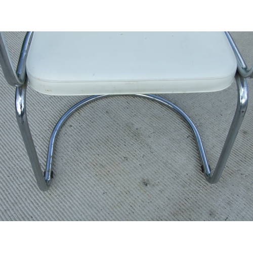 679 - A set of four French Soudex Vinyl tubular chrome and white vinyl dining chairs (4).