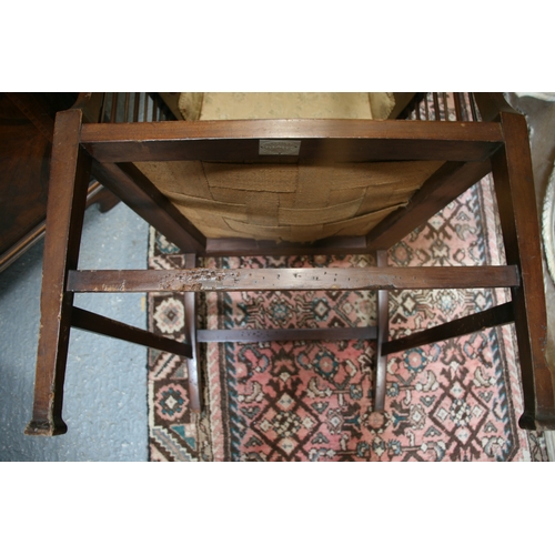 732 - An Arts & Crafts wingback chair with turned spindles, bears plaque 'Goodyer's Regent St & Bond St, L... 