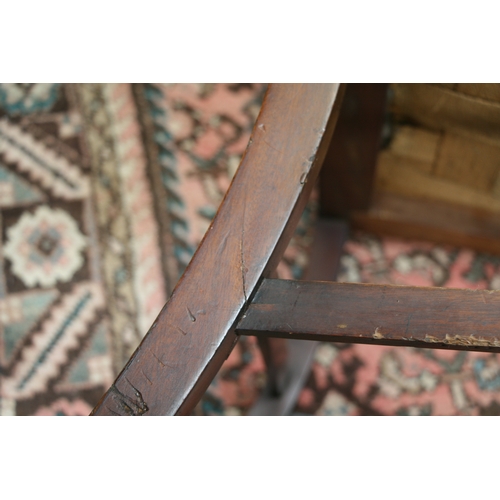 732 - An Arts & Crafts wingback chair with turned spindles, bears plaque 'Goodyer's Regent St & Bond St, L... 