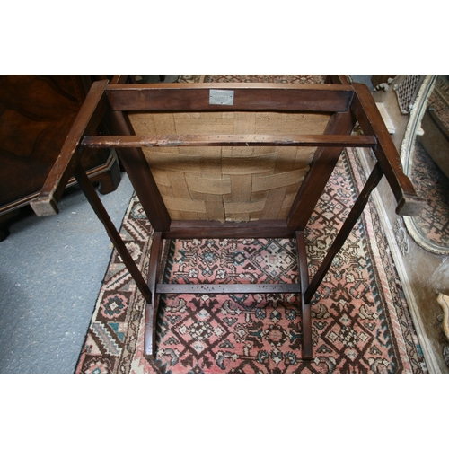 732 - An Arts & Crafts wingback chair with turned spindles, bears plaque 'Goodyer's Regent St & Bond St, L... 