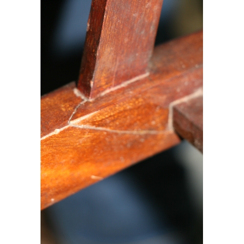 732 - An Arts & Crafts wingback chair with turned spindles, bears plaque 'Goodyer's Regent St & Bond St, L... 