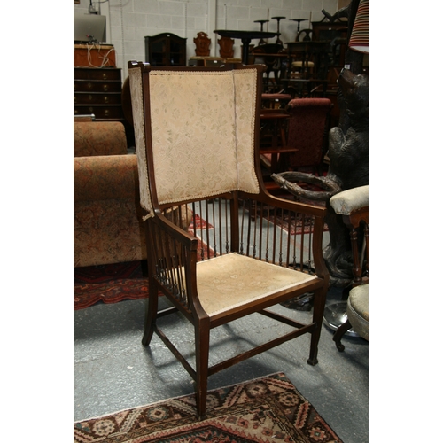 732 - An Arts & Crafts wingback chair with turned spindles, bears plaque 'Goodyer's Regent St & Bond St, L... 