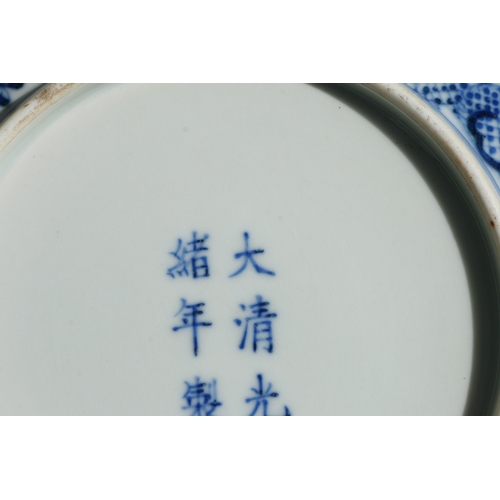 519 - A pair of Chinese blue & white shallow dishes decorated with dragons chasing a flaming pearl amongst... 